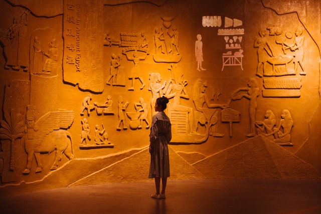 Egypt woman standing infron of the wall.jpg